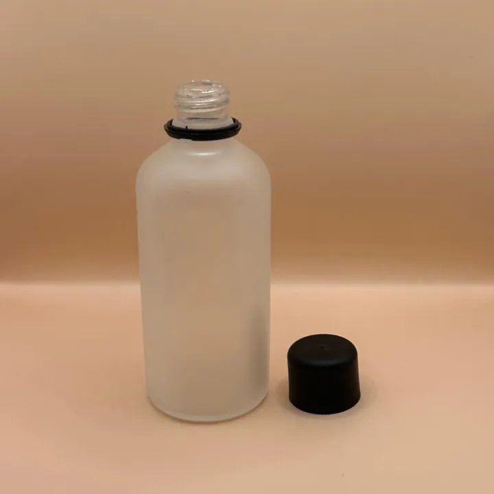Glass Bottle 100ML Glass Round Bottle Frosted Pilfer Proof Cap Black Smooth With Plug for personal care packaging