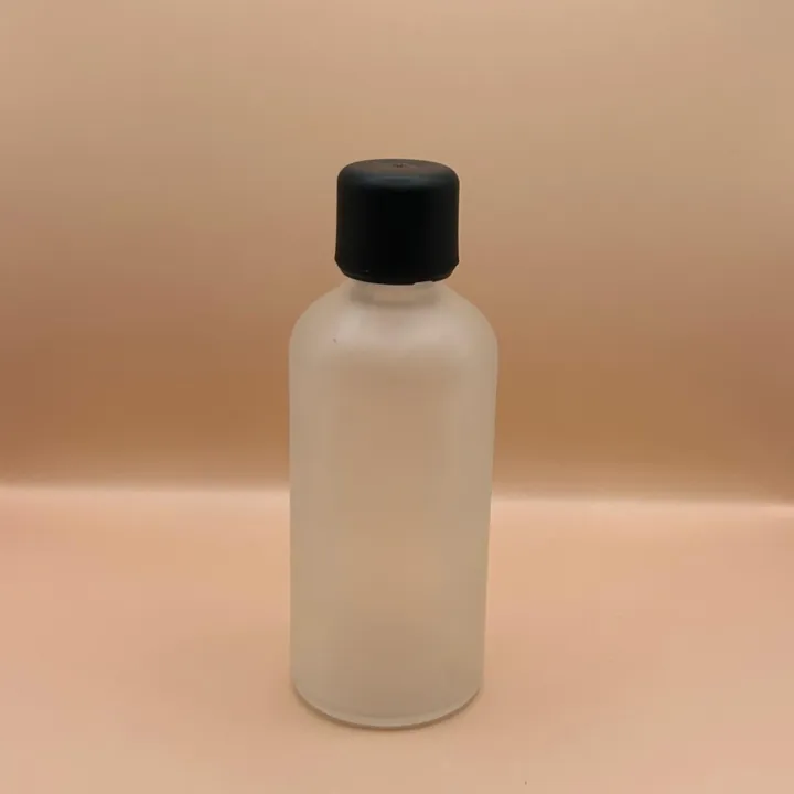 Glass Bottle 100ML Glass Round Bottle Frosted Pilfer Proof Cap Black Smooth With Plug for personal care packaging