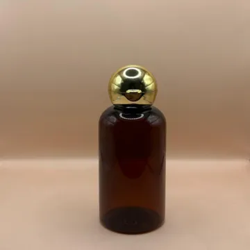 100ML PET Boston Bottle With 24/410 Dom Flip-Top Cap Golden Coating | Elegant Packaging for Personal Care