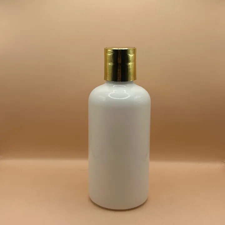200ML BOSTON BOTTLE WITH GOLDEN COATED DISCTOP CAP 200ML PET Boston Bottle with 24/410 Dis-Top Cap Golden Coating | Premium Cosmetic Packaging