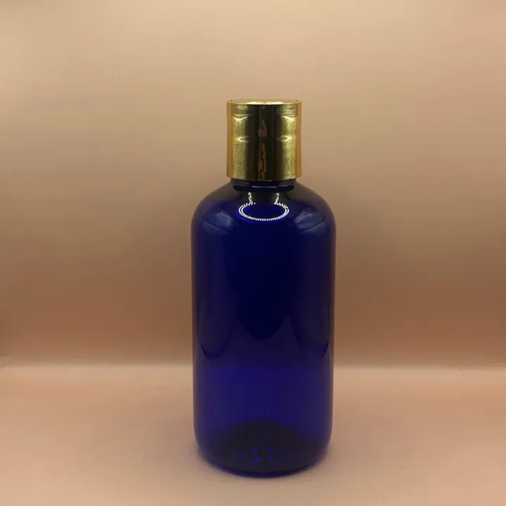 200ML PET Boston Bottle with 24/410 Dis-Top Cap Golden Coating | Premium Cosmetic Packaging