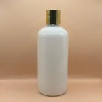 300ML PET Boston Bottle With 24/410 Disc-Top Cap Golden Coating | Premium Cosmetic Packaging